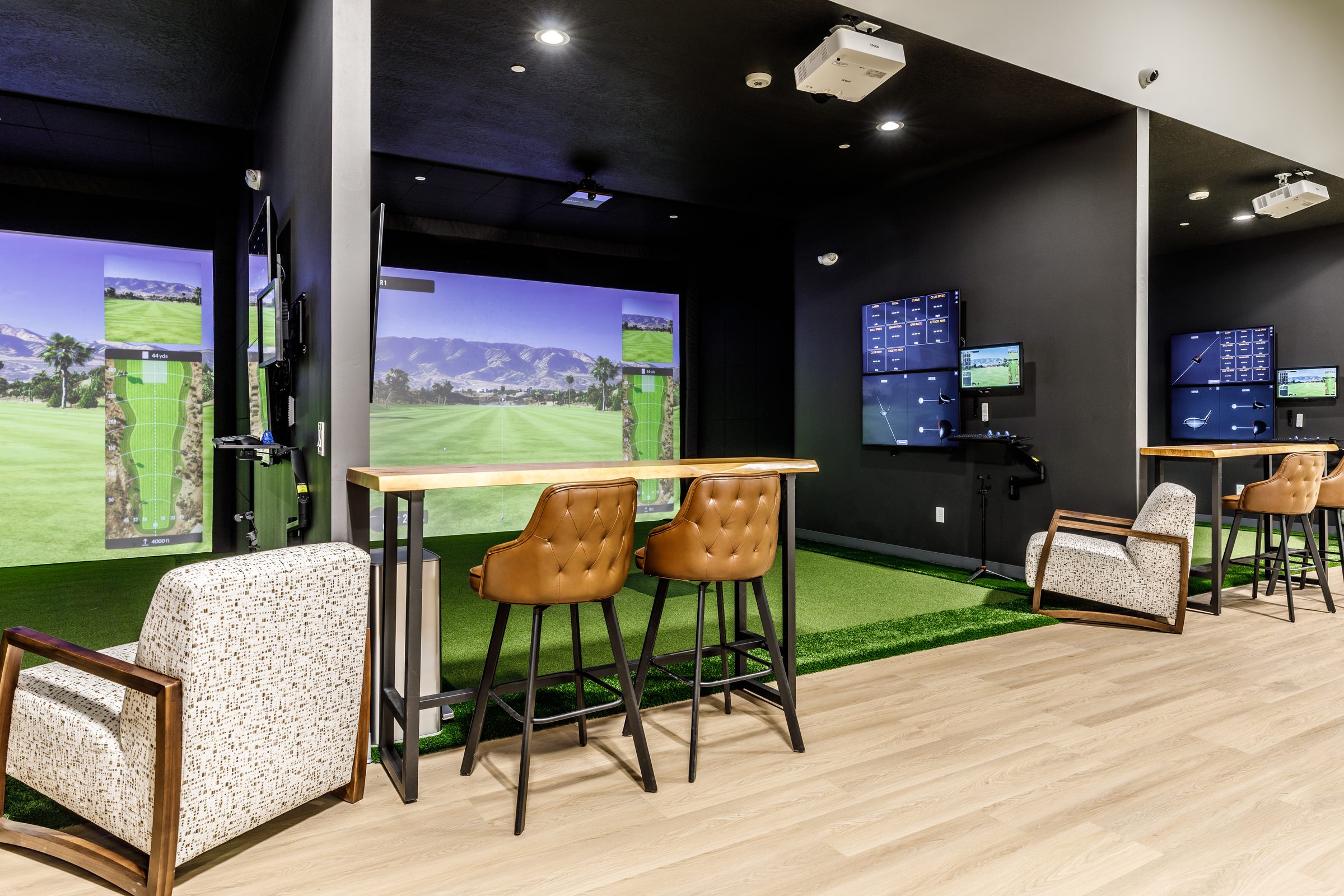 Row of TrackMan bays with bar-height seating