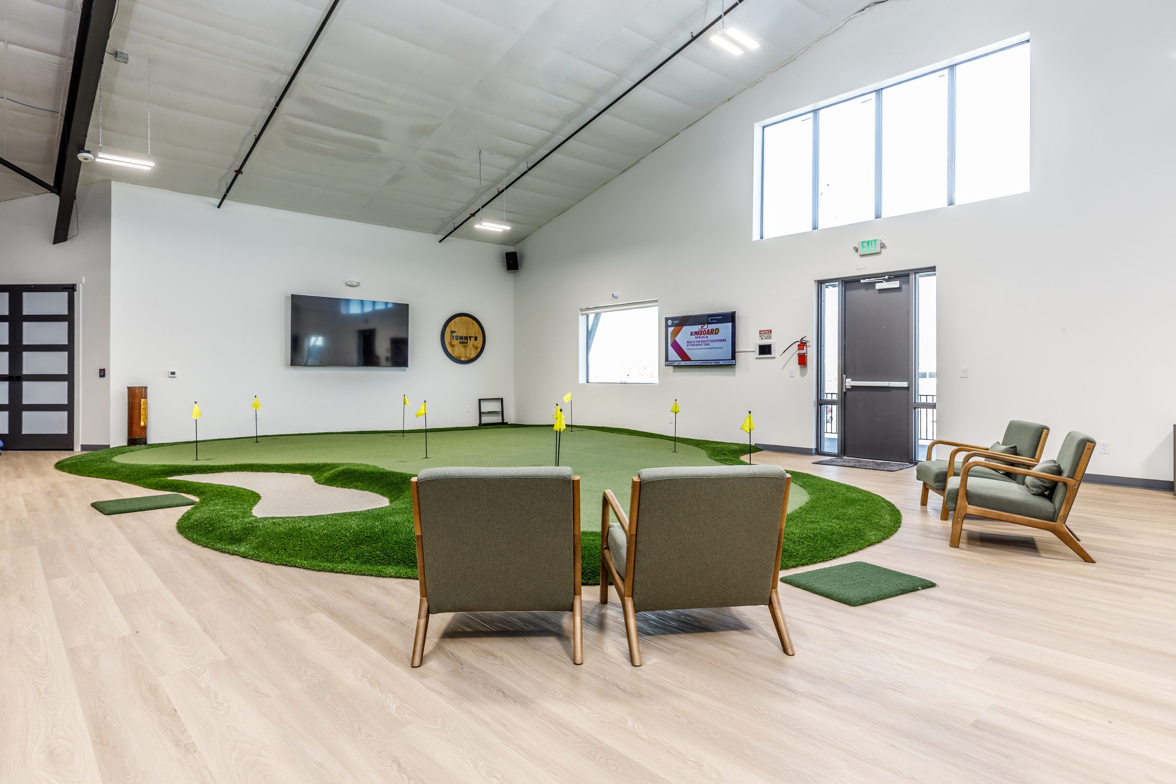 Putting and chipping green with lounge seating